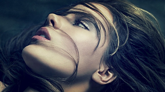 Kate Beckinsale looking up with hair covering her face