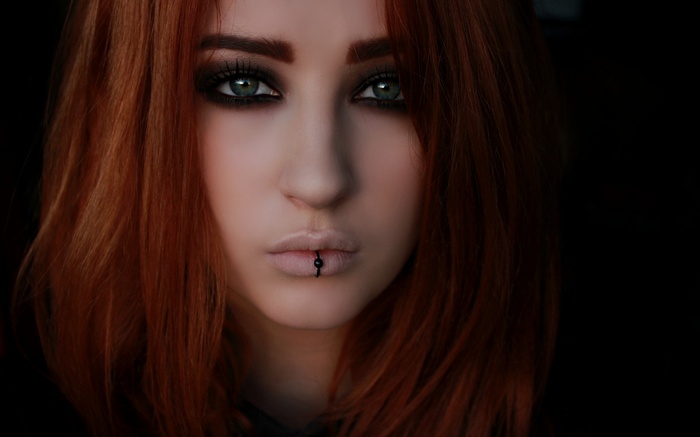 Niky Von Macabre with green eyes and red hair