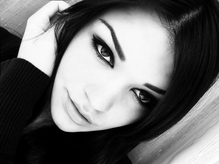 Monochrome portrait of a woman with long hair and juicy lips