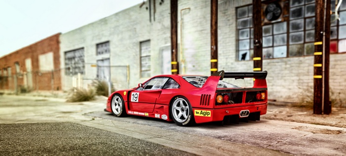 Red Ferrari F40 race car parked outdoors