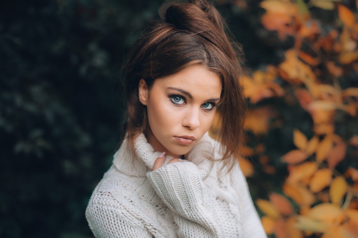 Portrait of a woman with blue eyes wearing a sweater