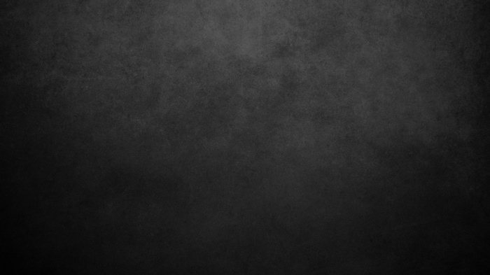 Dark textured surface with subtle lighting