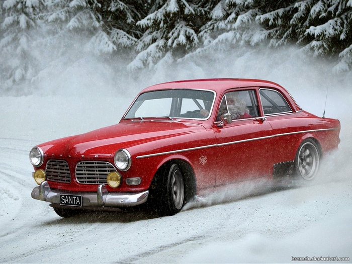 Santa Claus driving a red Volvo in the snow