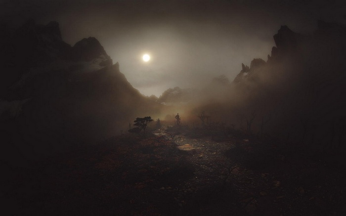Man standing in misty mountains of Patagonia, Chile