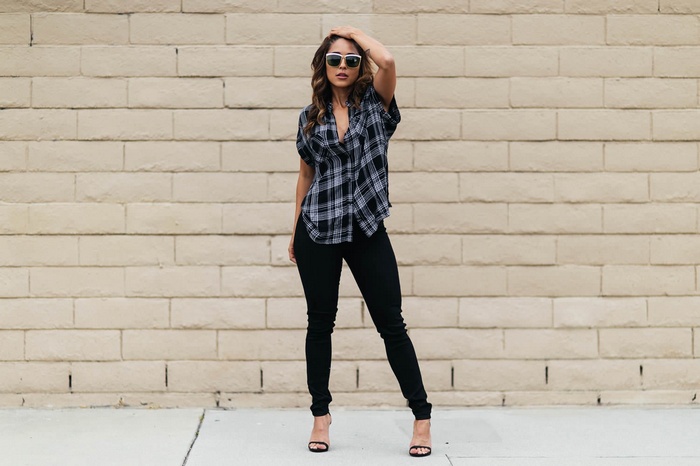 Tianna Gregory wearing sunglasses and plaid shirt