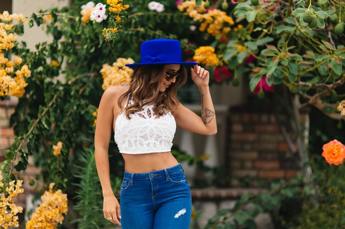 Tianna Gregory wearing a blue hat and jeans