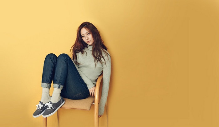 Krystal wearing jeans and a turtleneck