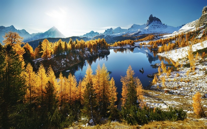 Autumn lake and snowy mountains in the Dolomites