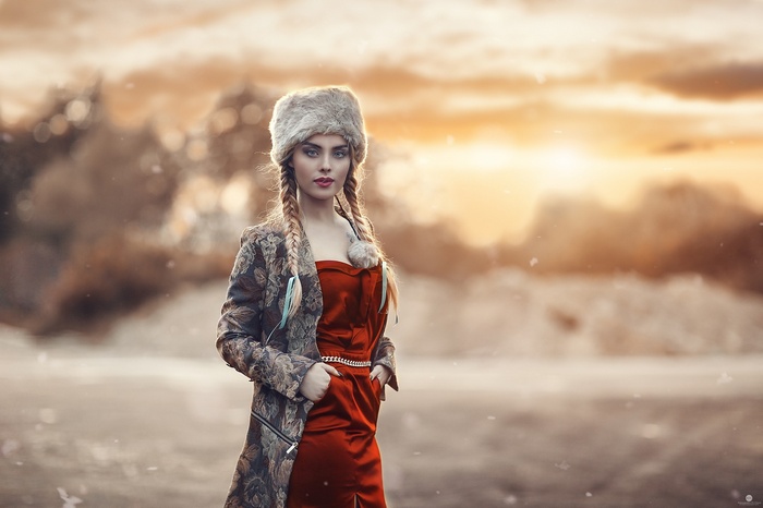 Woman in fur cap and red dress by Alessandro Di Cicco