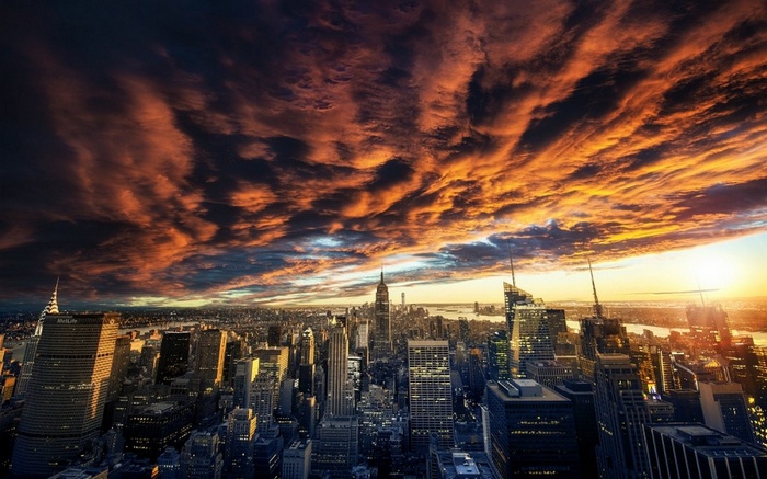 New York City Skyline at Sunset with Dramatic Clouds