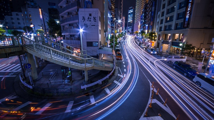 Night street in Japan with light trails from cars