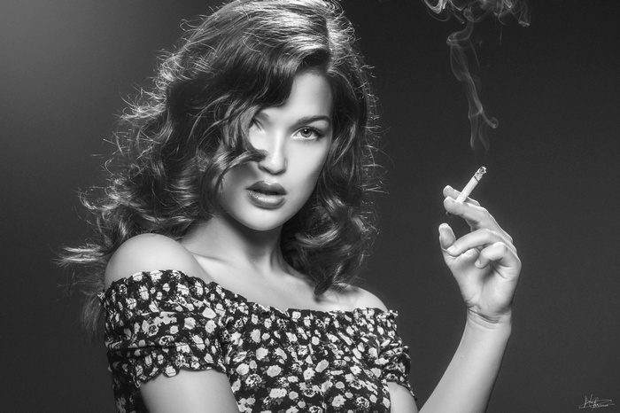 Monochrome portrait of a woman smoking