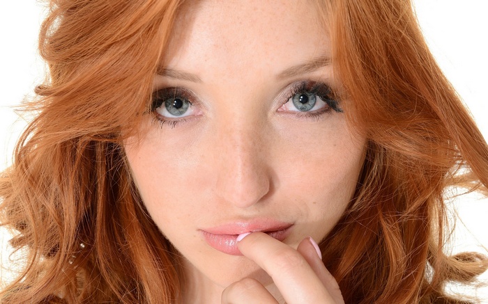 Michelle H. Paghie with red hair and green eyes