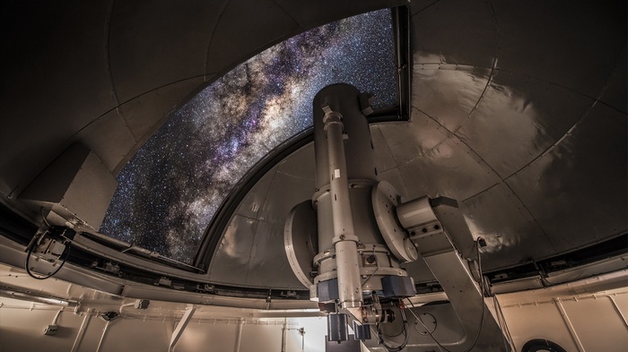 Observatory telescope viewing the Milky Way galaxy