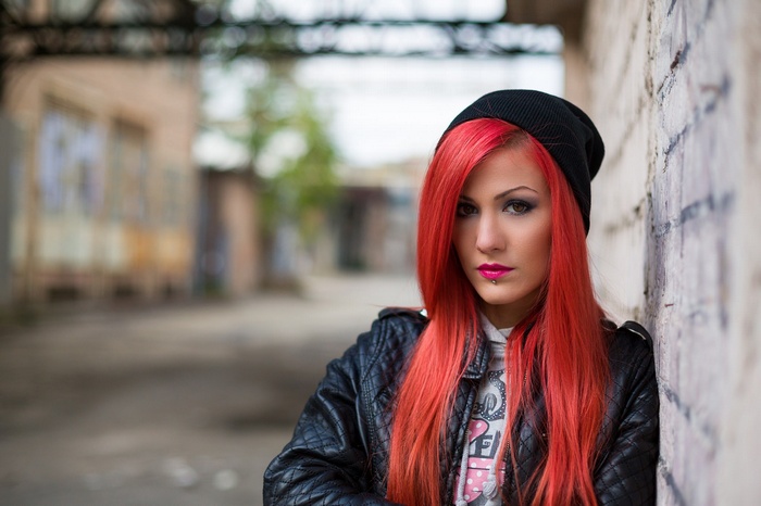 Woman with red hair and piercings