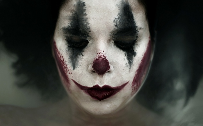 Close-up of a person with clown makeup