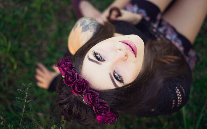 Woman with flower crown looking up