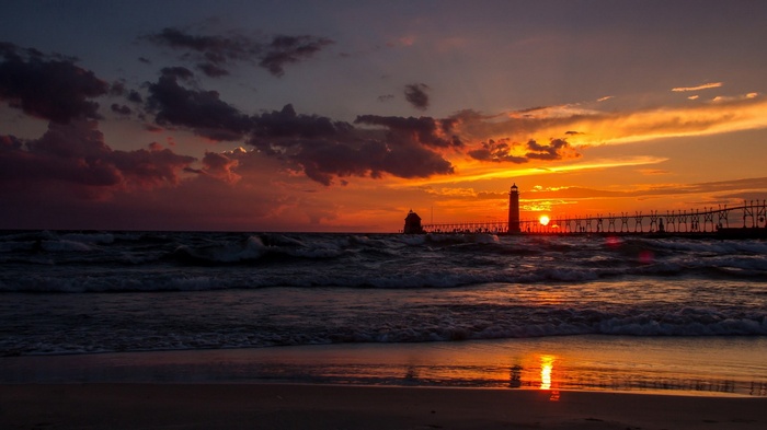 Sunset over Lake Michigan with Grand Haven Lighthouse