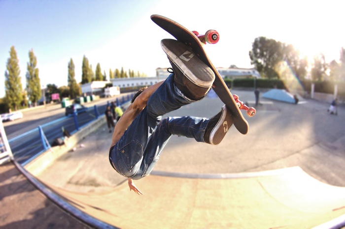 Skateboarder performing a trick in a skatepark