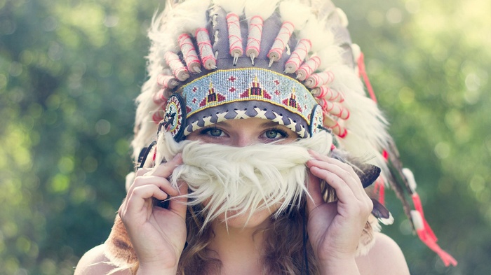 Woman wearing a Native American headdress