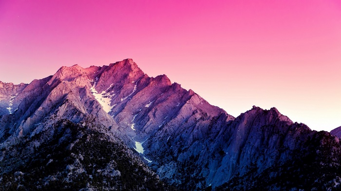 Mountains under a pink and purple sky