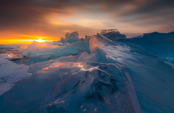 Ice formations at sunset on a frozen landscape