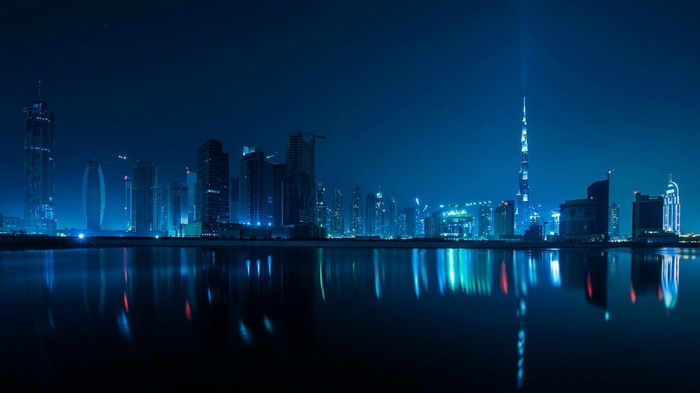 Dubai skyline at night with reflections