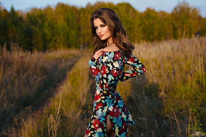 Woman in a floral dress in a field