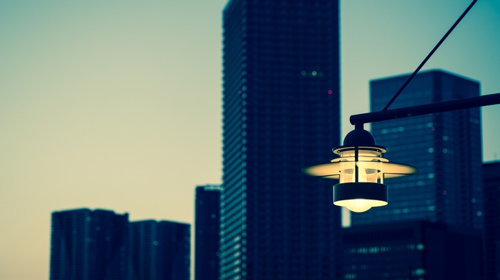 Street lamp in front of city skyscrapers