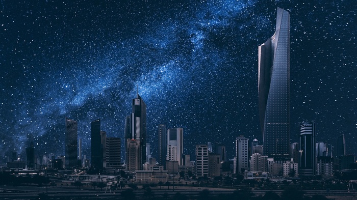 Kuwait City skyline under a starry night sky