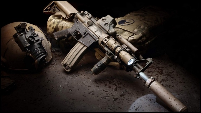 AR-15 rifle with night vision scope and tactical gear