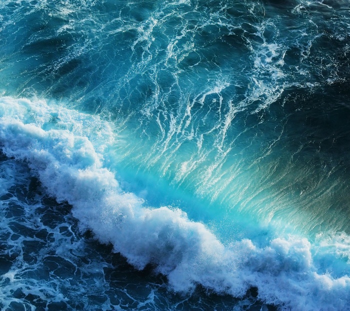 Ocean waves crashing with turquoise water