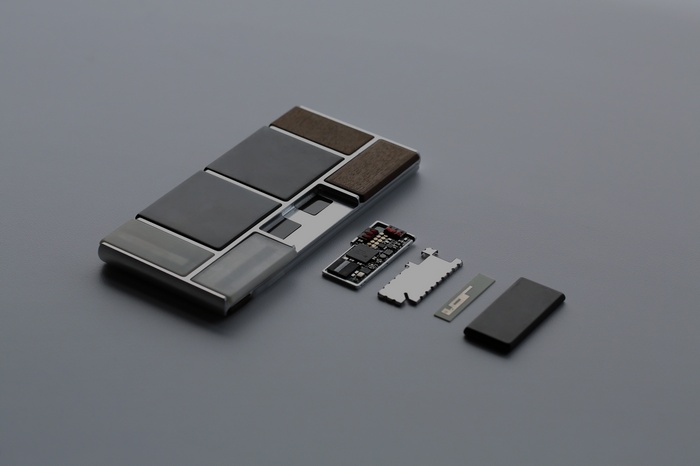 Modular phone components on a gray surface