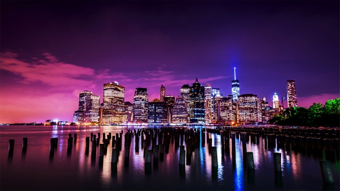 New York City skyline at night with reflections