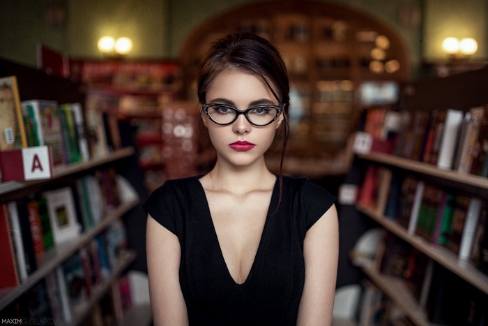 Portrait of Oktyabrina Maximova in a library