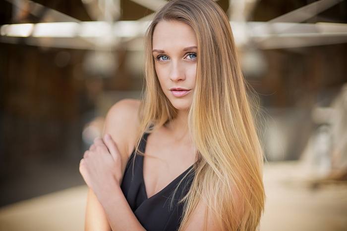 Woman with blonde hair in a black dress