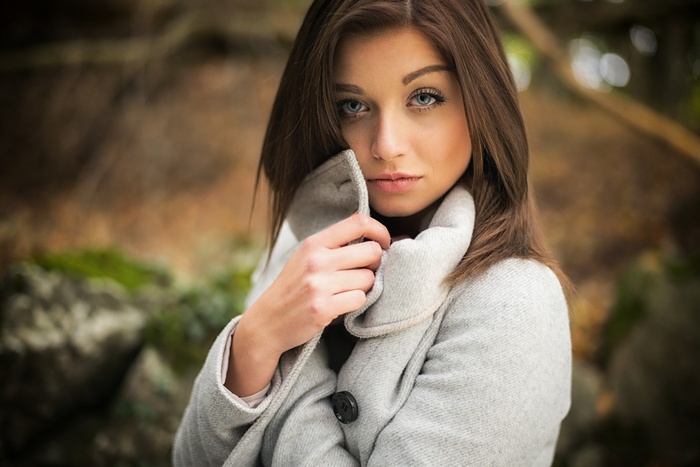 Woman with blue eyes wearing a coat