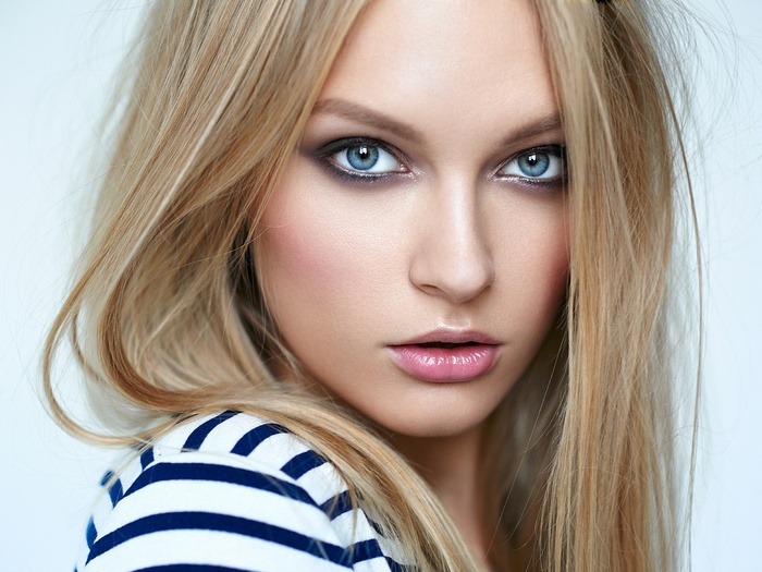 Woman with blonde hair and blue eyes