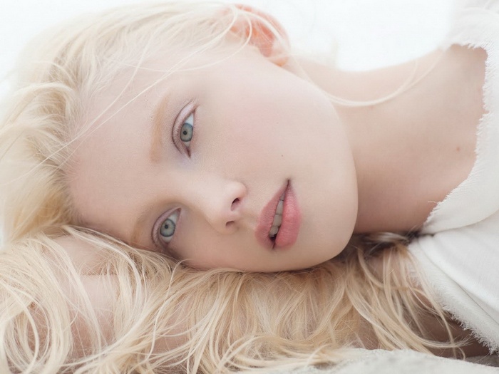 Portrait of Daria Zhemkova with blonde hair and blue eyes