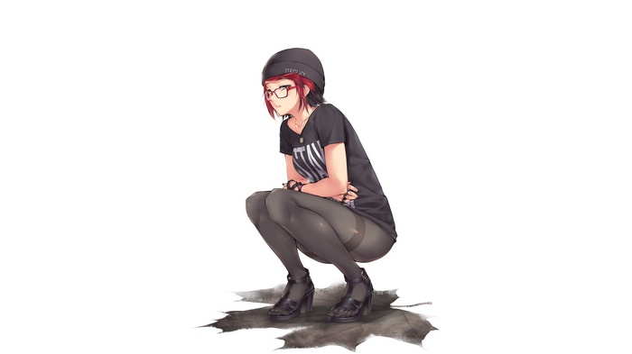 Redhead girl in glasses squatting on maple leaves