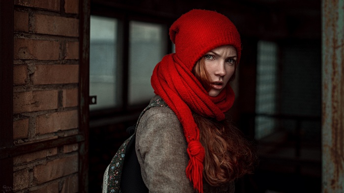 Oksana Butovskaya wearing a red hat and scarf