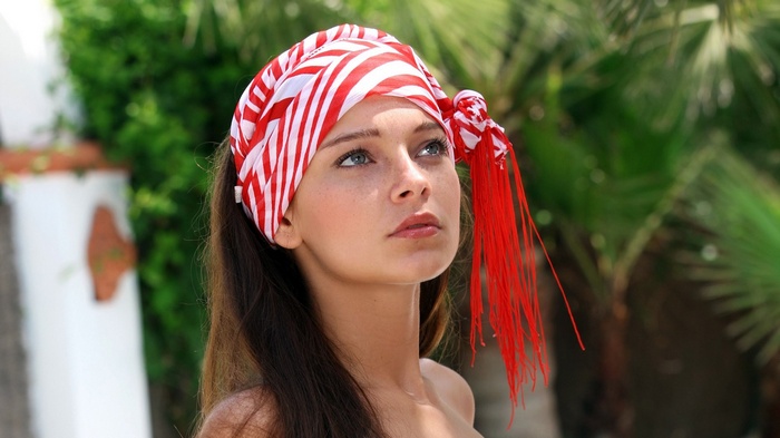 Young woman with red and white headscarf