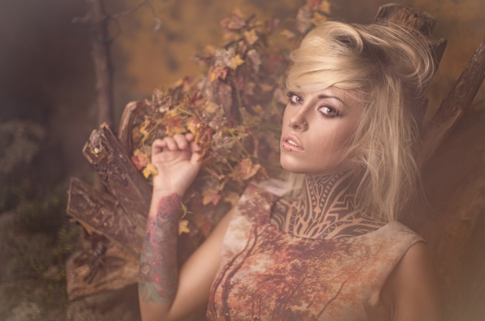 Woman with blonde hair and tattoos