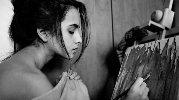 Woman painting on canvas