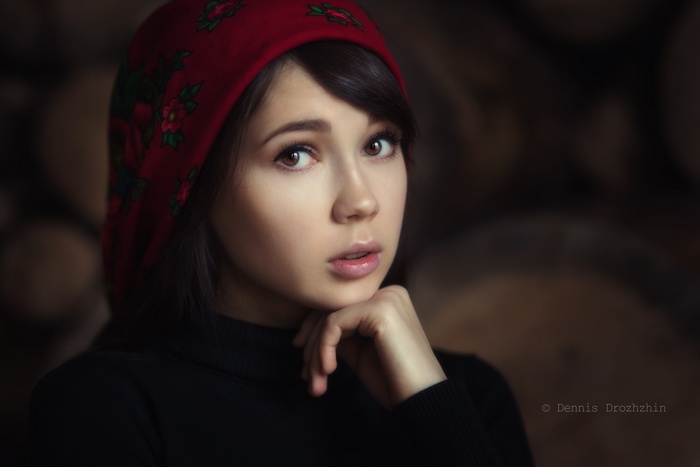 Portrait of Ekaterina Ermakova wearing a red headscarf