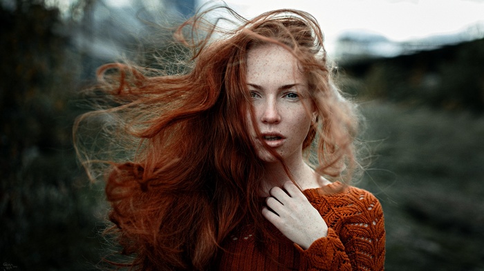Oksana Butovskaya with red hair in the wind