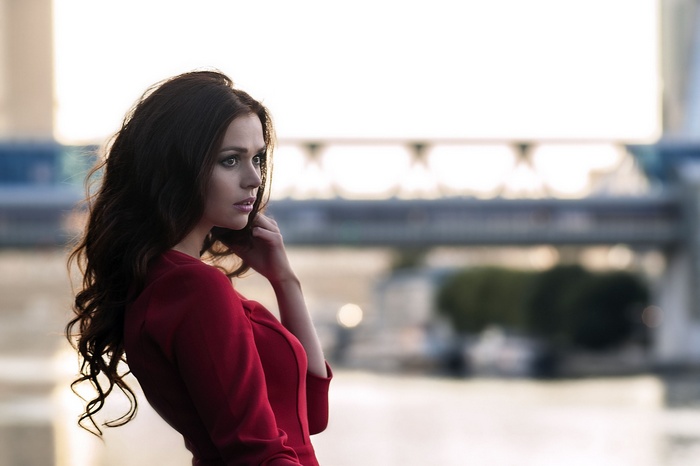 Woman in red dress looking away