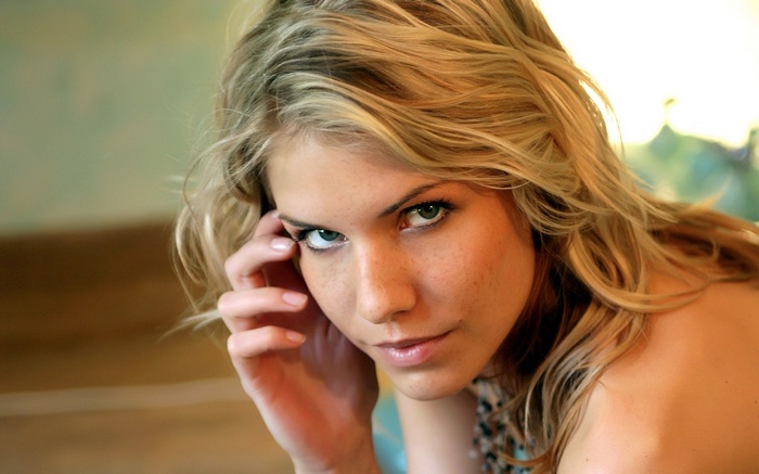 Iveta Vale with blonde hair and green eyes