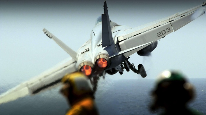 McDonnell Douglas FA-18 Hornet taking off from aircraft carrier