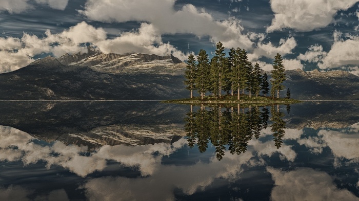 Island with trees reflected in a lake with mountains